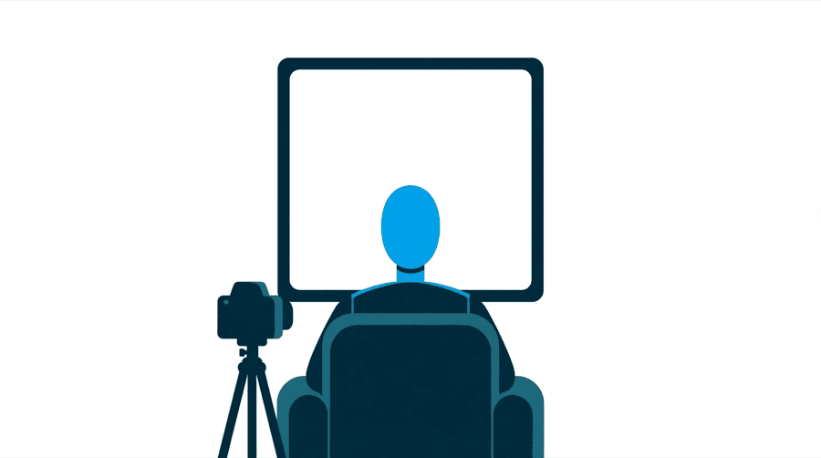Illustration: a figure sitting in an armchair with their back to us facing a very large blank screen, with a camera on a tripod beside them